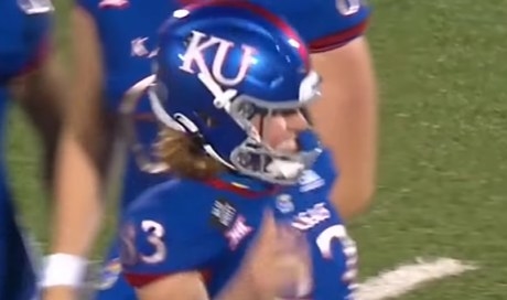 Blue helmet with the white letters &quot;KU&quot;