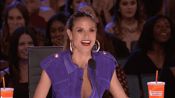 GIF of Heidi Klum on America&#x27;s Got Talent, opening her mouth wide in shock