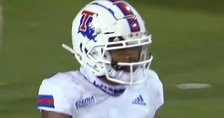 White helmet with the state of Louisiana on it (blue) and a red &quot;T&quot; overlaying it