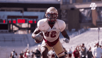 Gold helmet with a maroon stripe