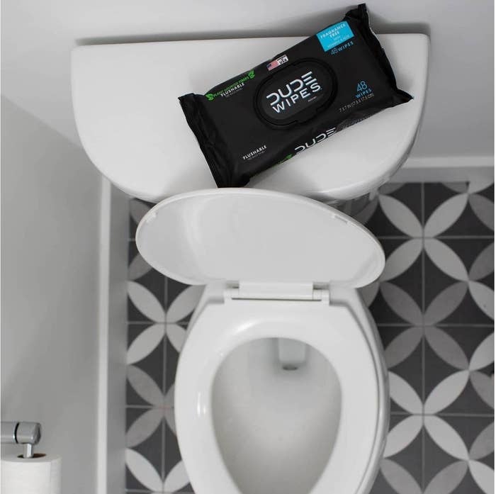 A set of flushable wipes on a toilet 