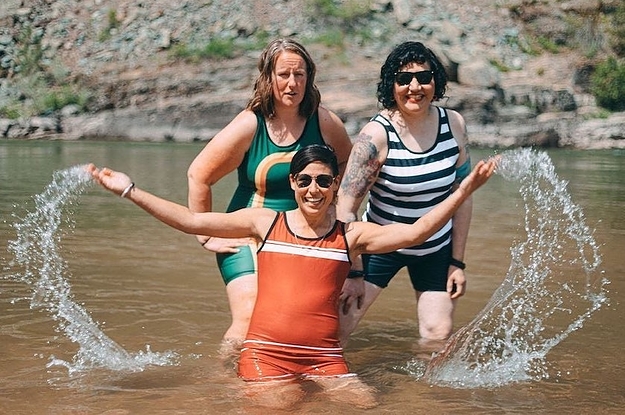 three models in the water, one of the models is wearing the stone fox swimsuit, another model is wearing the original swimsuit, and the other model is wearing the dreamboat striped swimsuit