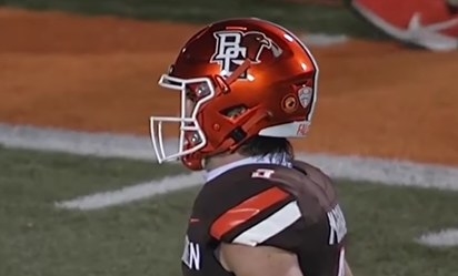 Orange helmet with the white letters &quot;BG&quot; interlocked and a falcon head peeking out behind them