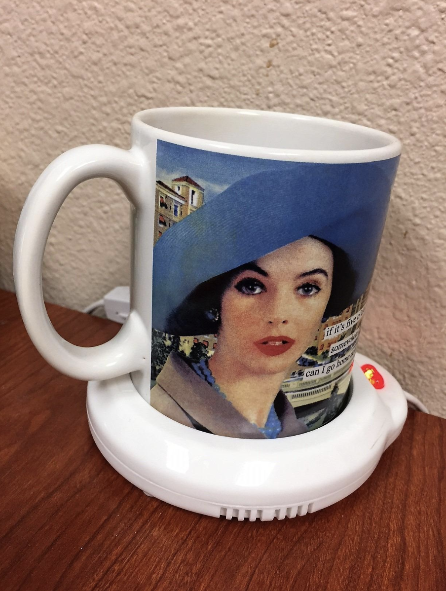 Reviewer image of a mug resting on a white mug warmer 