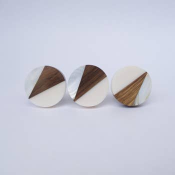 circular flat knobs with triangle geometric design with wood, silver, and mother of pearl 