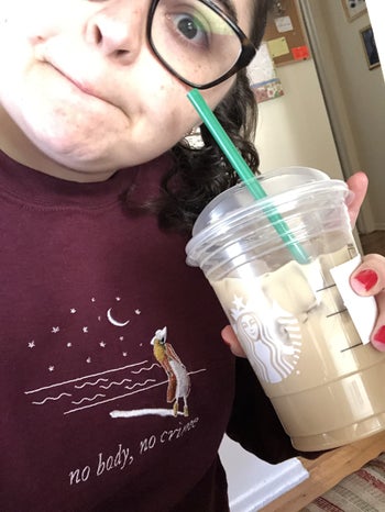 buzzfeed editor in a burgundy sweatshirt with 