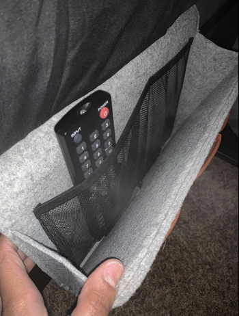 Pocket pulled open to show interior spot for a remote control 