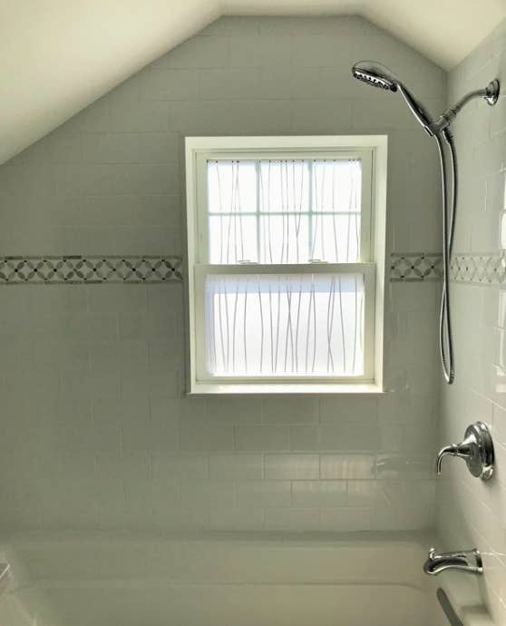 A customer review photo of their bathroom window with the film installed