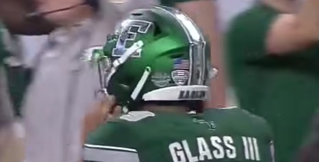 Kelly green helmet with a silver letter &quot;E&quot;