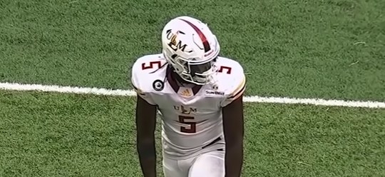 White helmet with the letters &quot;ULM&quot; in red