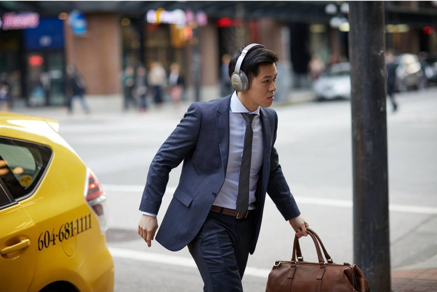 Model wearing noise-canceling headphones