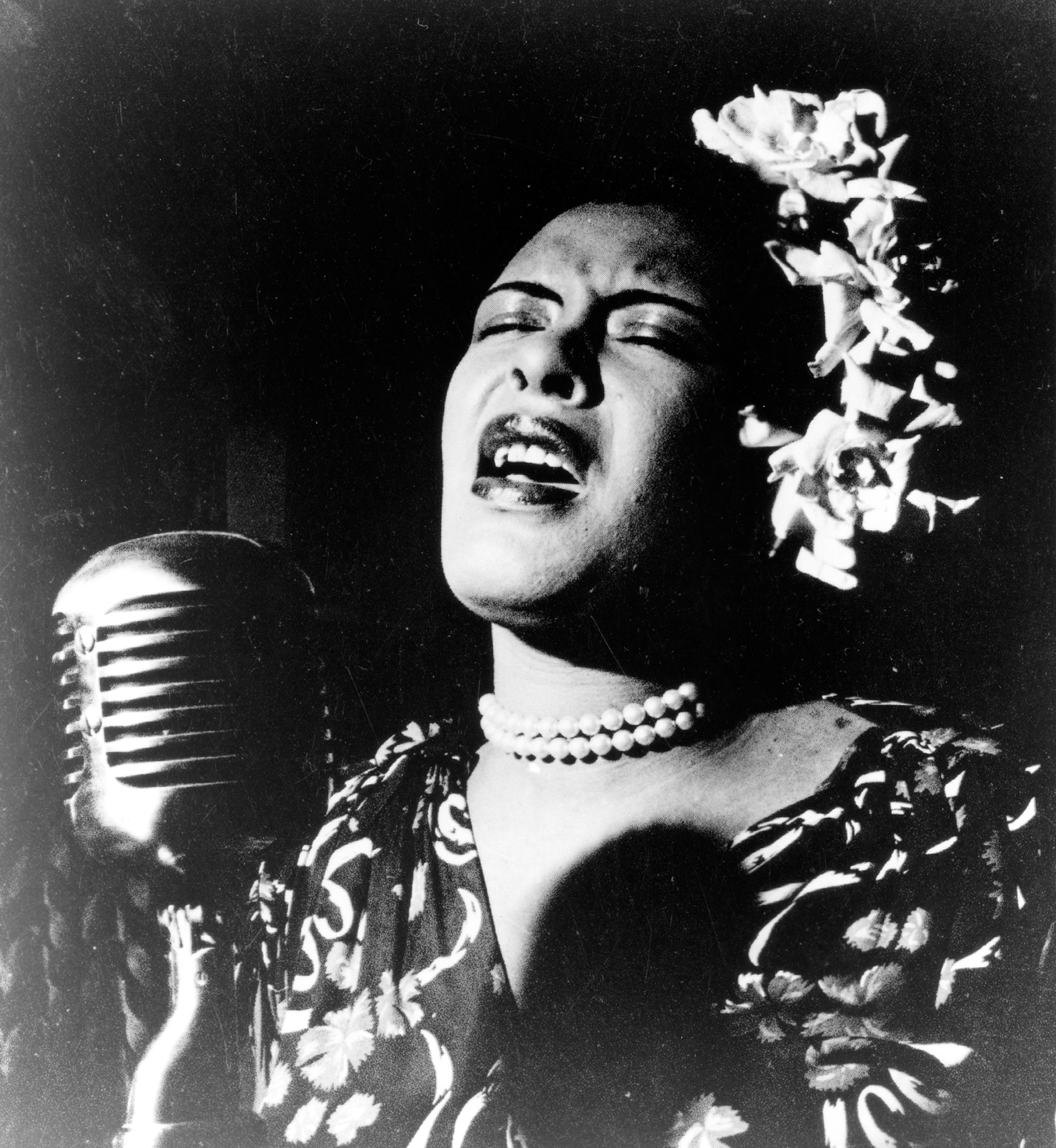 Billie holiday singing into microphone