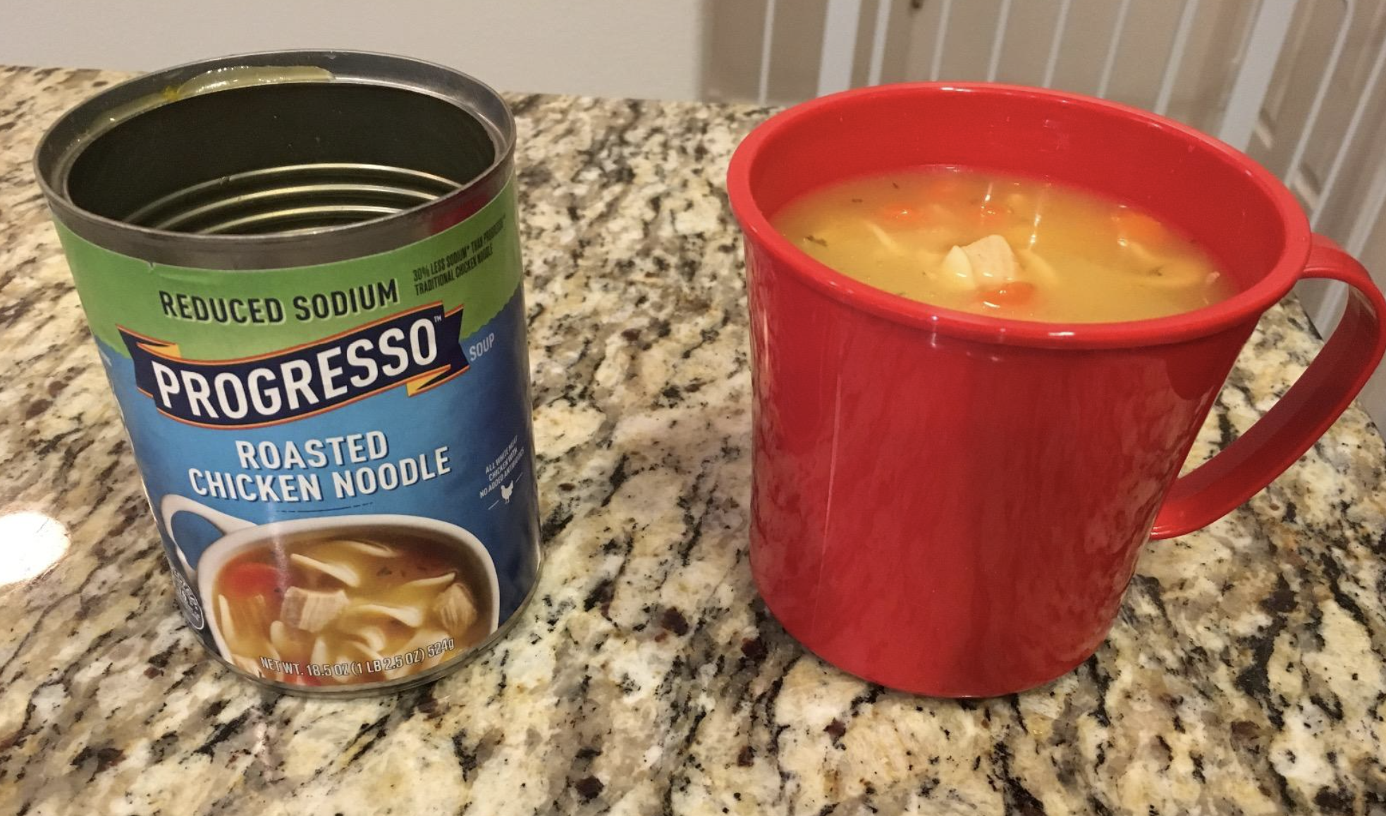 reviewer photo of the mug filled with soup next to the empty can of soup