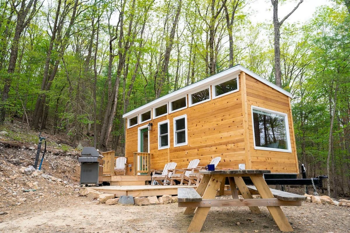 the tiny house in the middle of a forest 