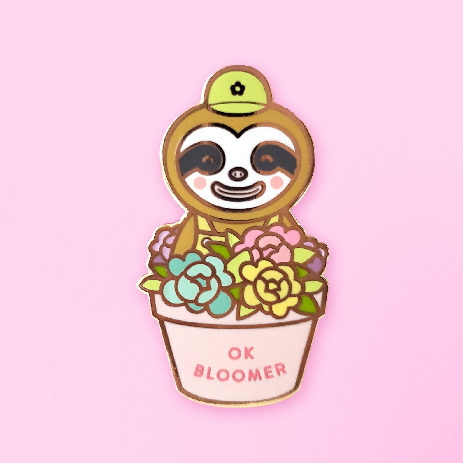 a sloth character from animal crossing in a flower pot that says "ok bloomer" on it