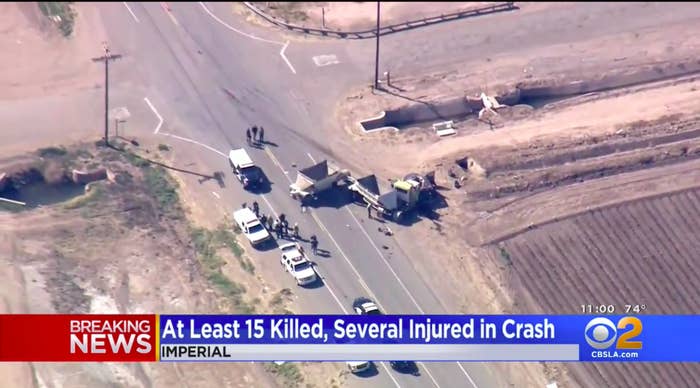 Two crushed vehicles are pictured near an intersection.