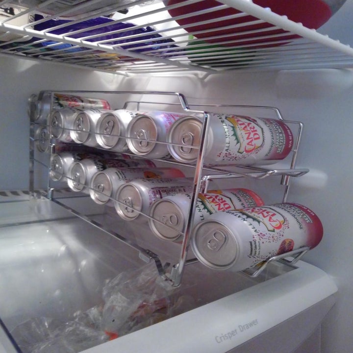 Reviewer photo of can organizer inside fridge filled with cans