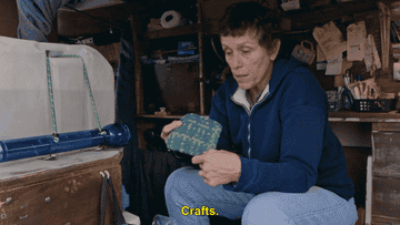 McDormand holding a crocheted trivet she made