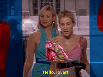 Carrie Bradshaw looking at a pink heeled sandal and saying &quot;Hello, lover!&quot;