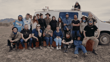 The crew of the film posing for a photo outside Vanguard