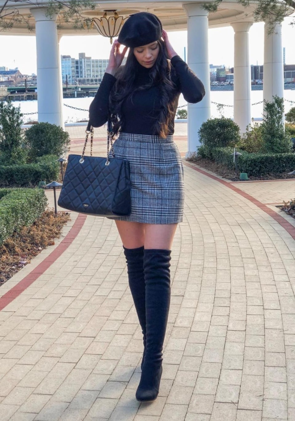 The skirt worn by an Amazon reviewer and paired with thigh high boots