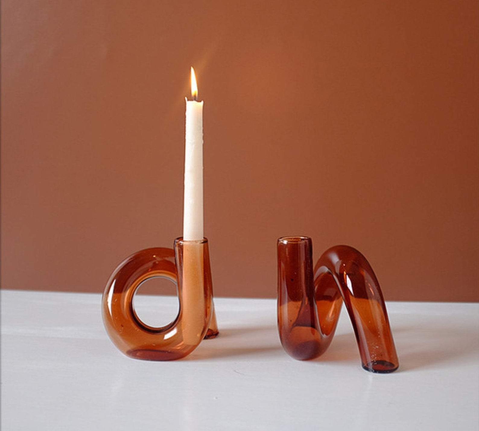 two of the twisted amber candle holders