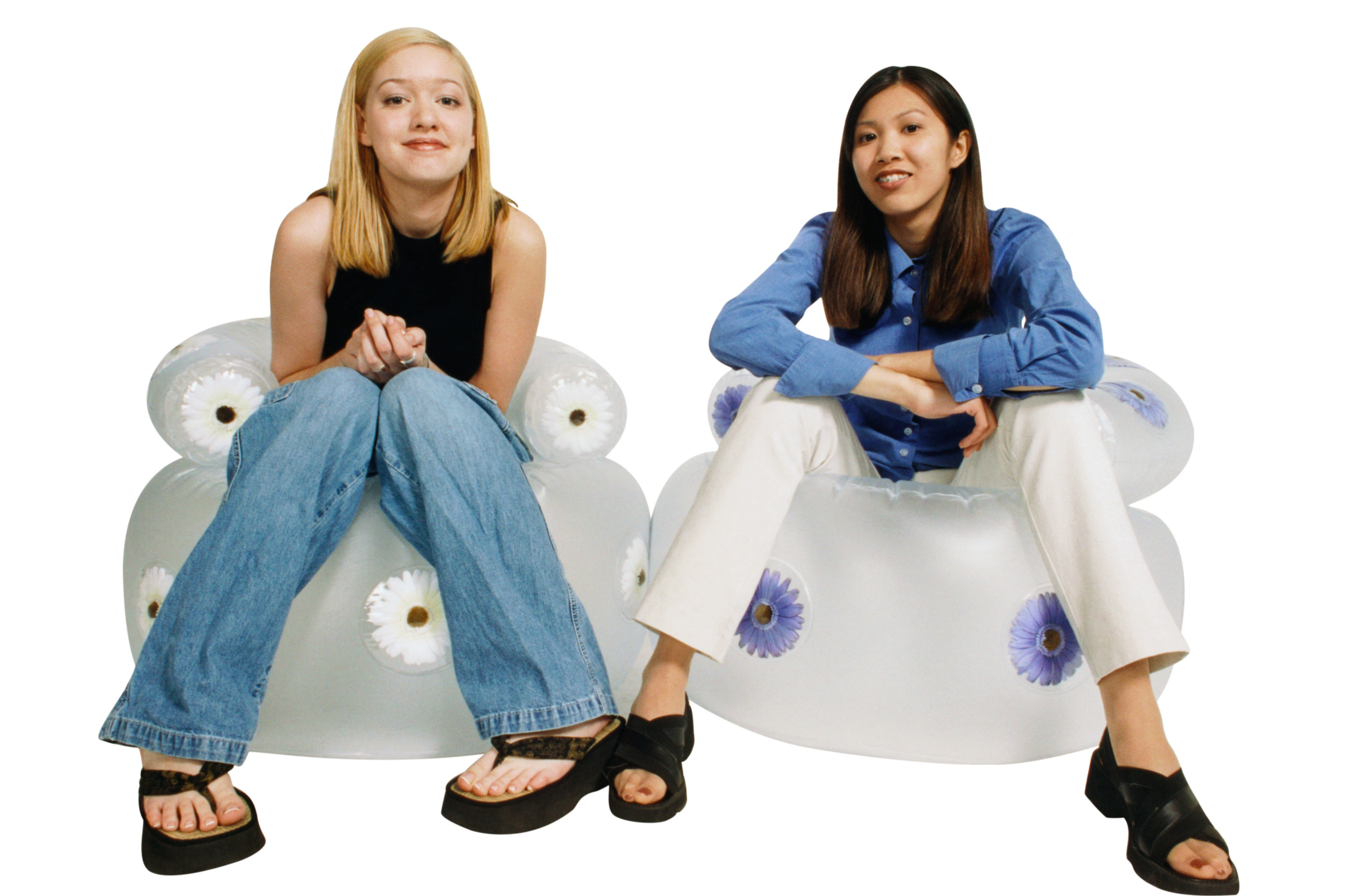 Two people from the '90s sitting in inflatable chairs