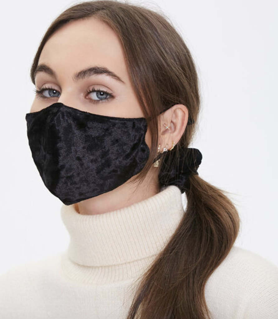 Model in black velvet face mask 