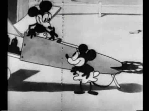 Mickey sitting in a plane while Minnie looks from the ground