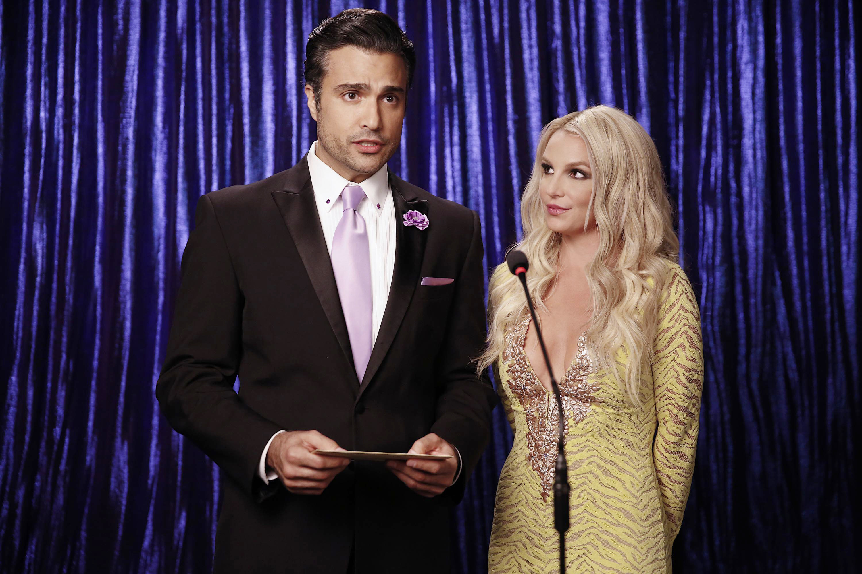 Rogelio presenting next to Britney on the show