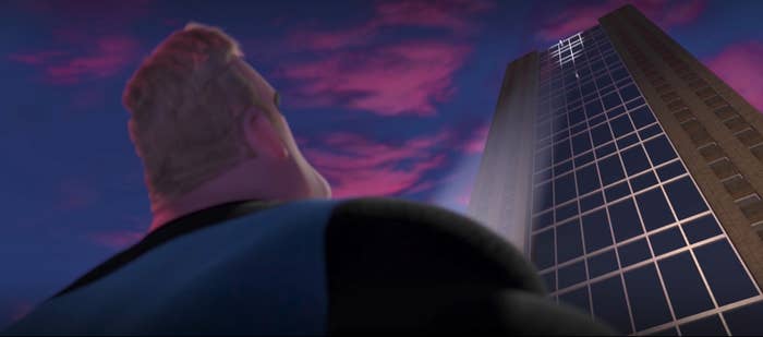 Mr Incredible watches as someone jumps off the roof of a skyscraper in The Incredibles