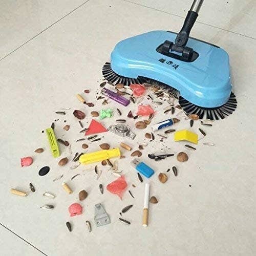 Auto spin mop cleaning trash off the floor.