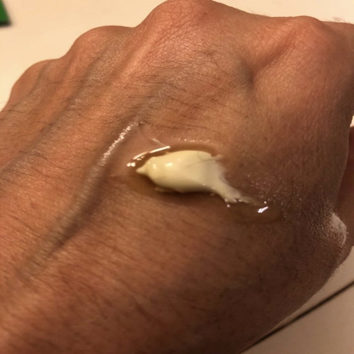 a reviewer's hand before using the moisturizer