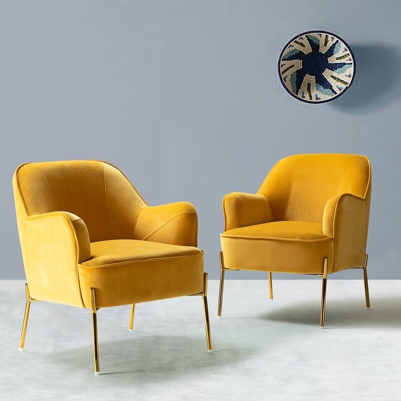 The set of two armchairs in mustard yellow