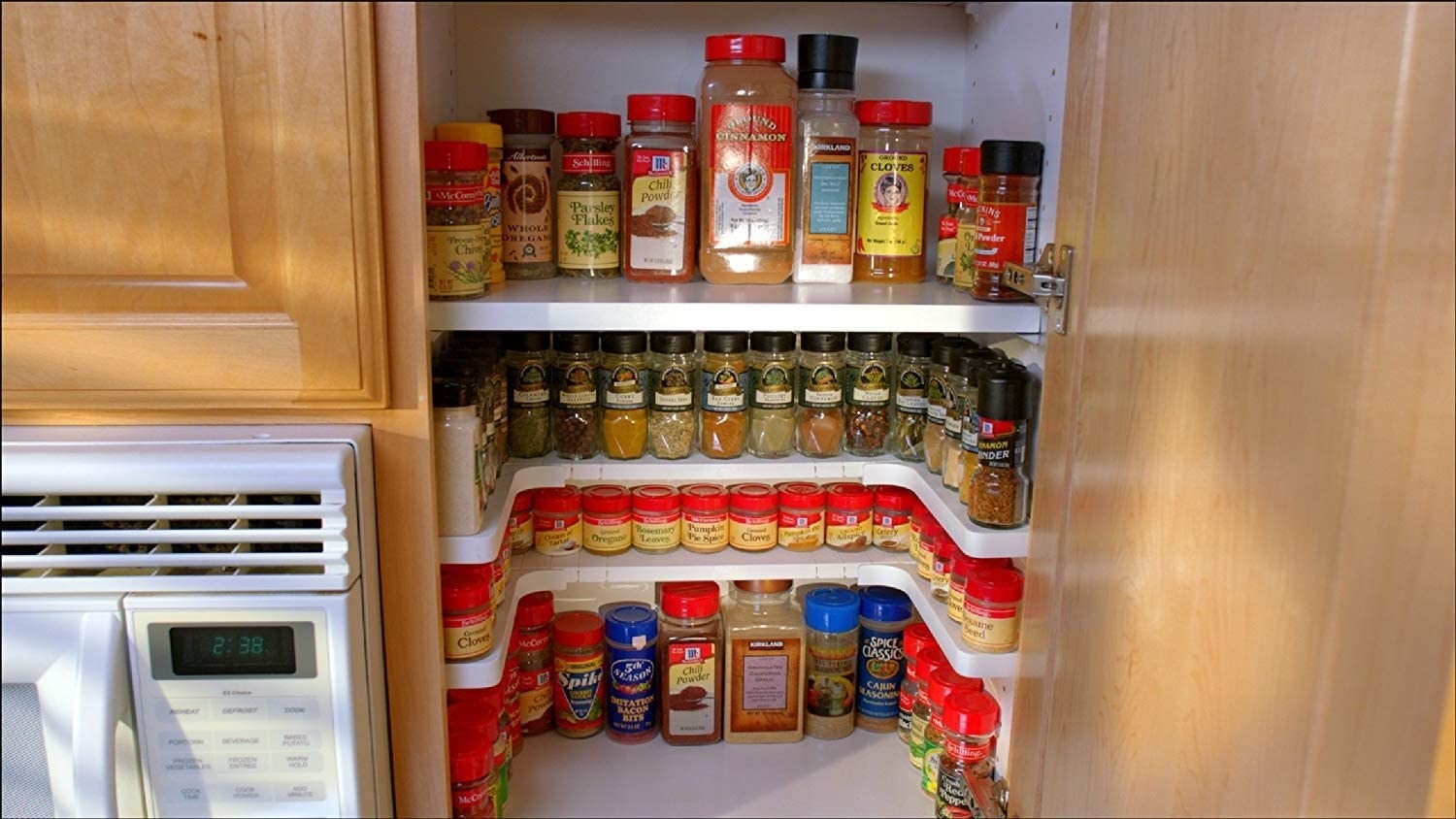 The multi-level shelf filled with spices