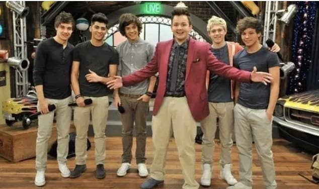 Photo of Gibby and members of One Direction