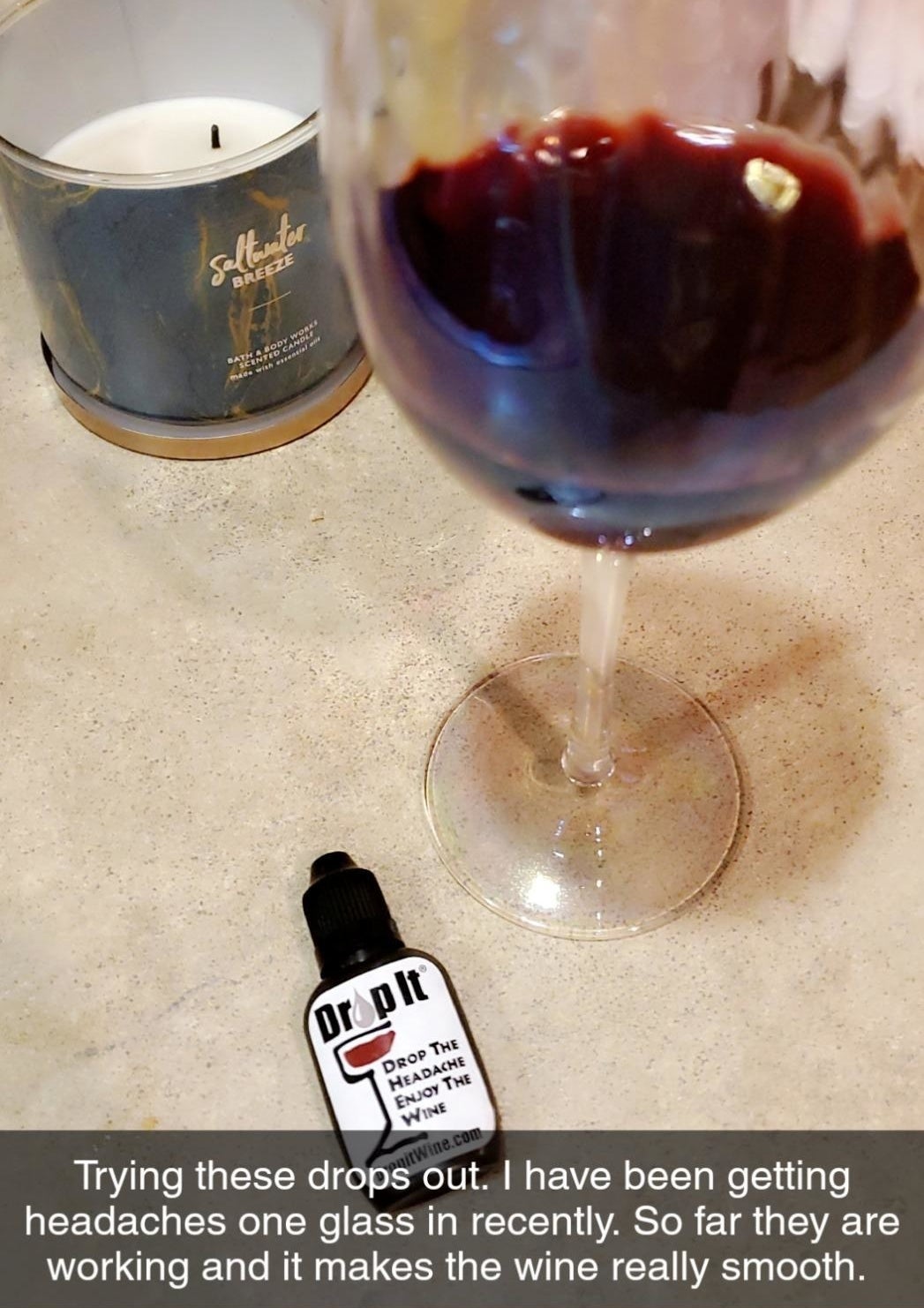 a glass of wine and the dropper bottle with text reading &quot;trying these drops out. I&#x27;ve been getting headaches one glass in recently. So far they are working and it makes the wine really smooth.&quot; 