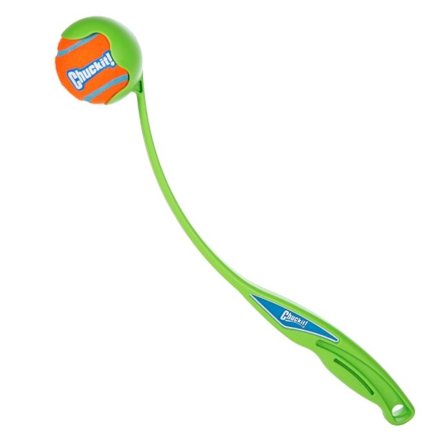The ball launcher toy holding an orange ball