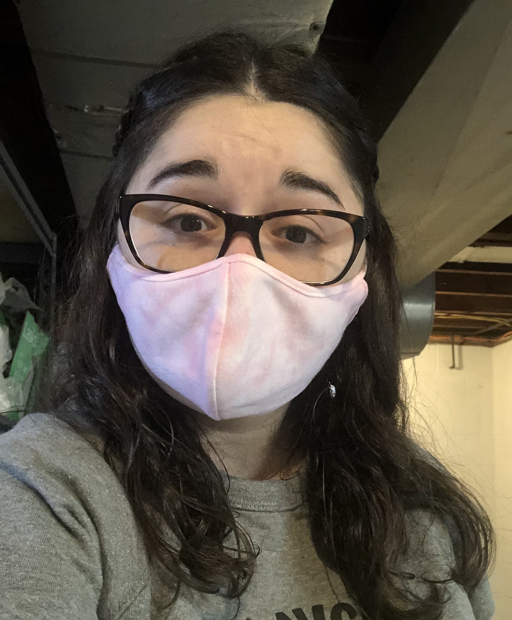 buzzfeed editor in a pink and white tie-dye face mask