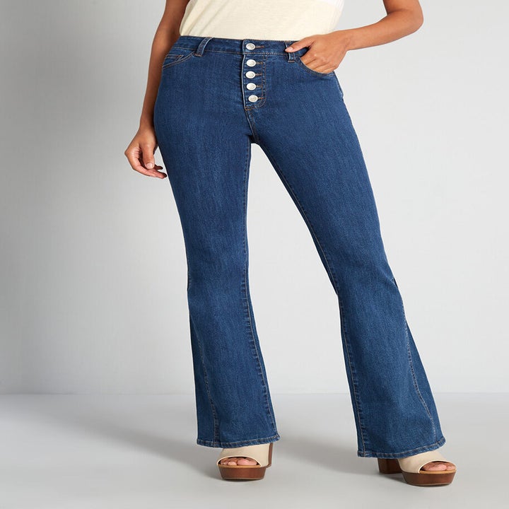 a model wearing flared jeans