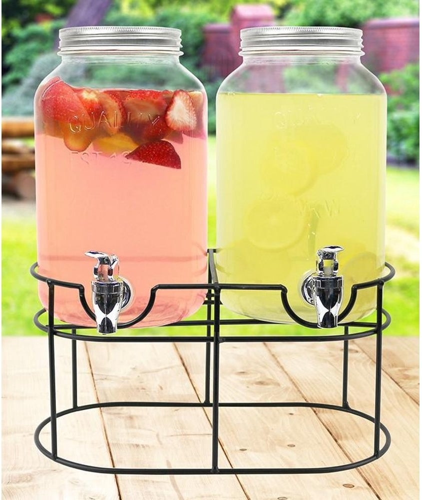 Drink dispensers filled with refreshing pink drink and yellow drink 