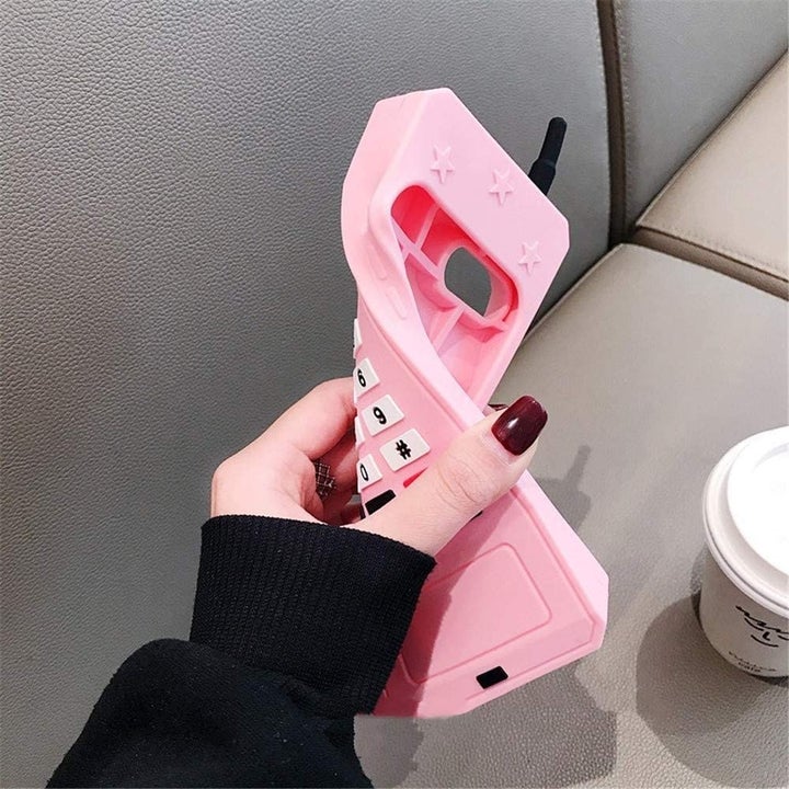 a model squishing the retro phone case