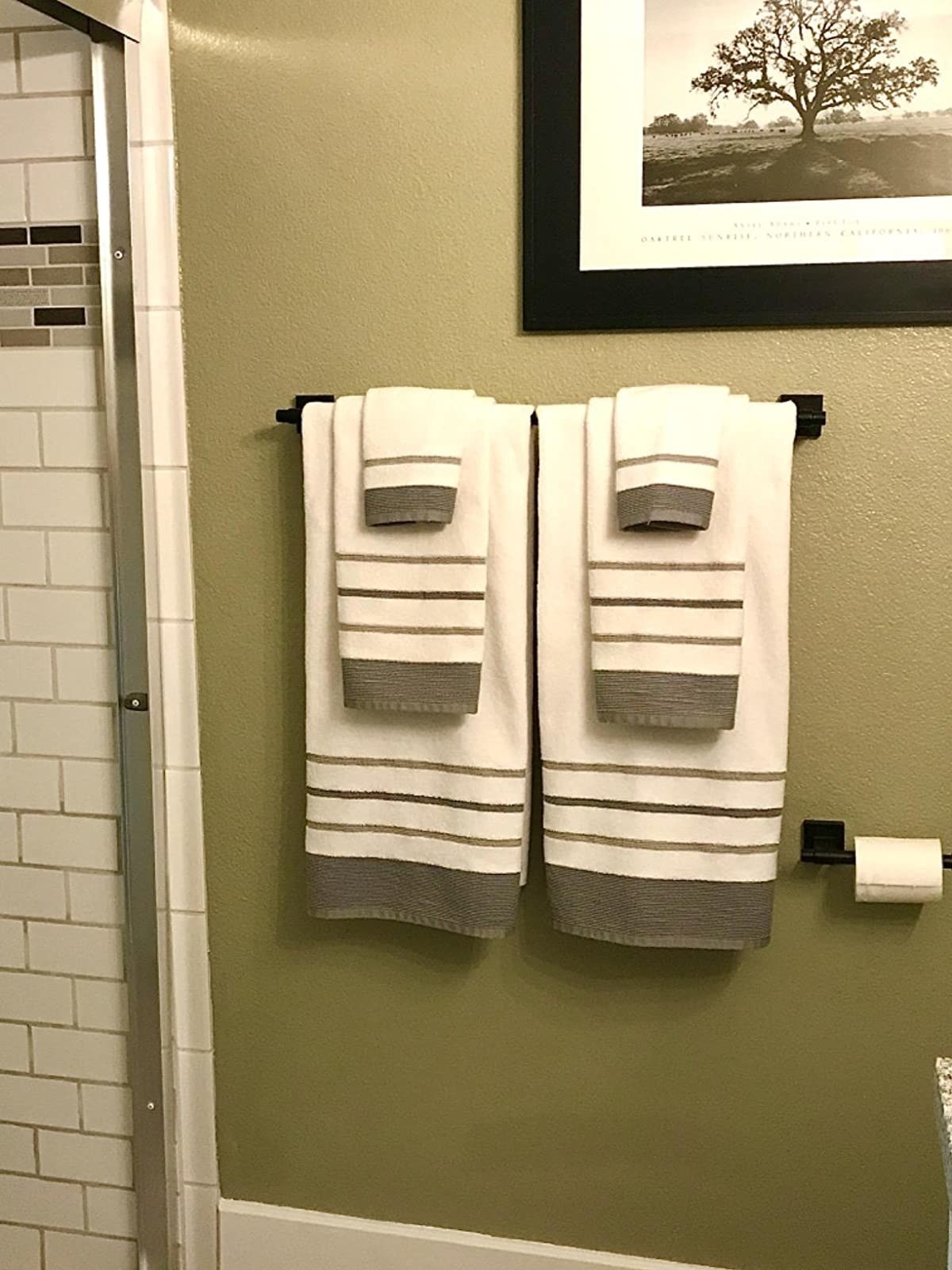The striped towels in a coordinating bathroom