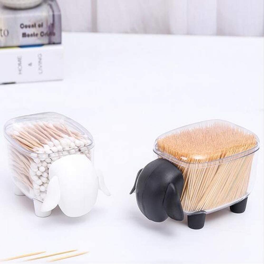 the sheep containers on a table, one filled with toothpicks and one with cotton swabs