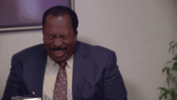 Stanley from The Office laughing
