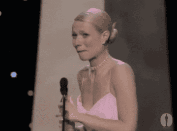 Gwyneth looks shocked to have won while onstage
