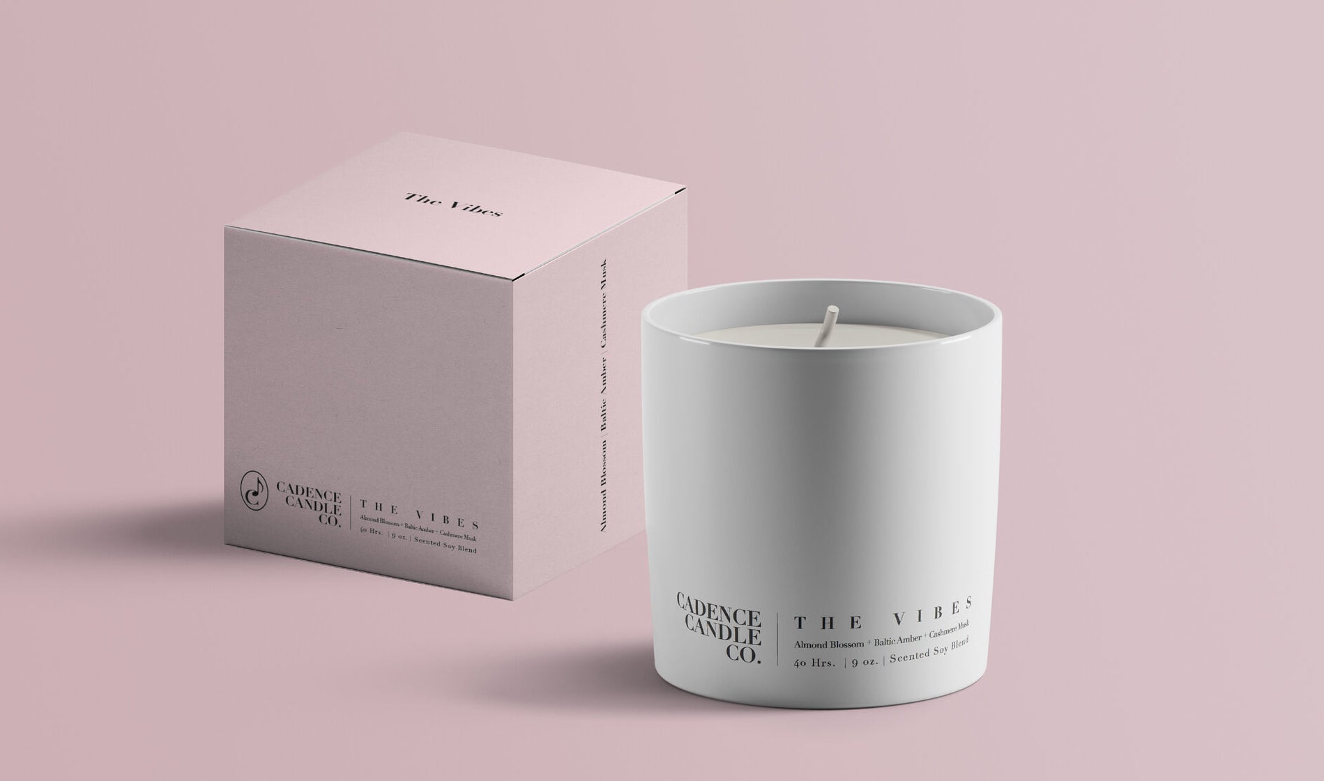 a white candle that says &quot;the vibes&quot; on it next to a pale blue box