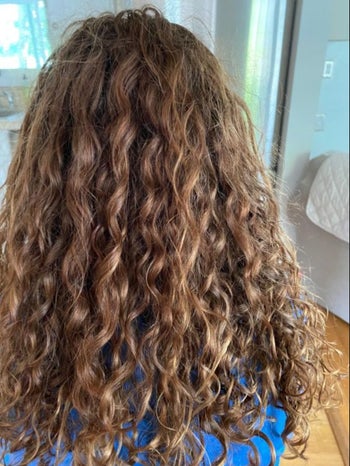 The back of a reviewers head after using the product