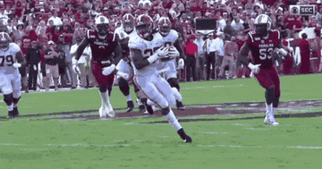 Najee Harris juking and hurdling players for a touchdown.