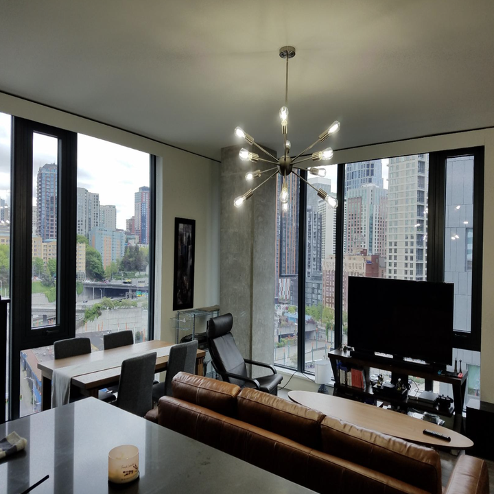 A customer review photo of the VINLUZ Sputnik Chandelier in Chrome hanging in their living room